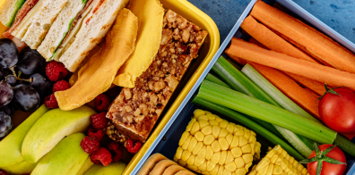 fruits, vegetables, sandwiches in two containers