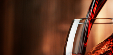 red wine being poured into a glass