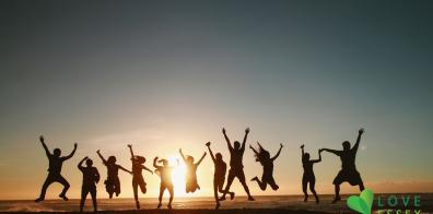 Silhouettes of people jumping